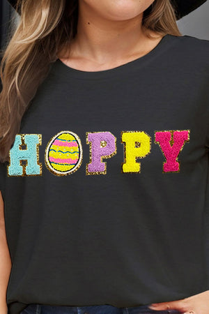 Black t-shirt with sequin "Hoppy" graphic and Easter egg detail.