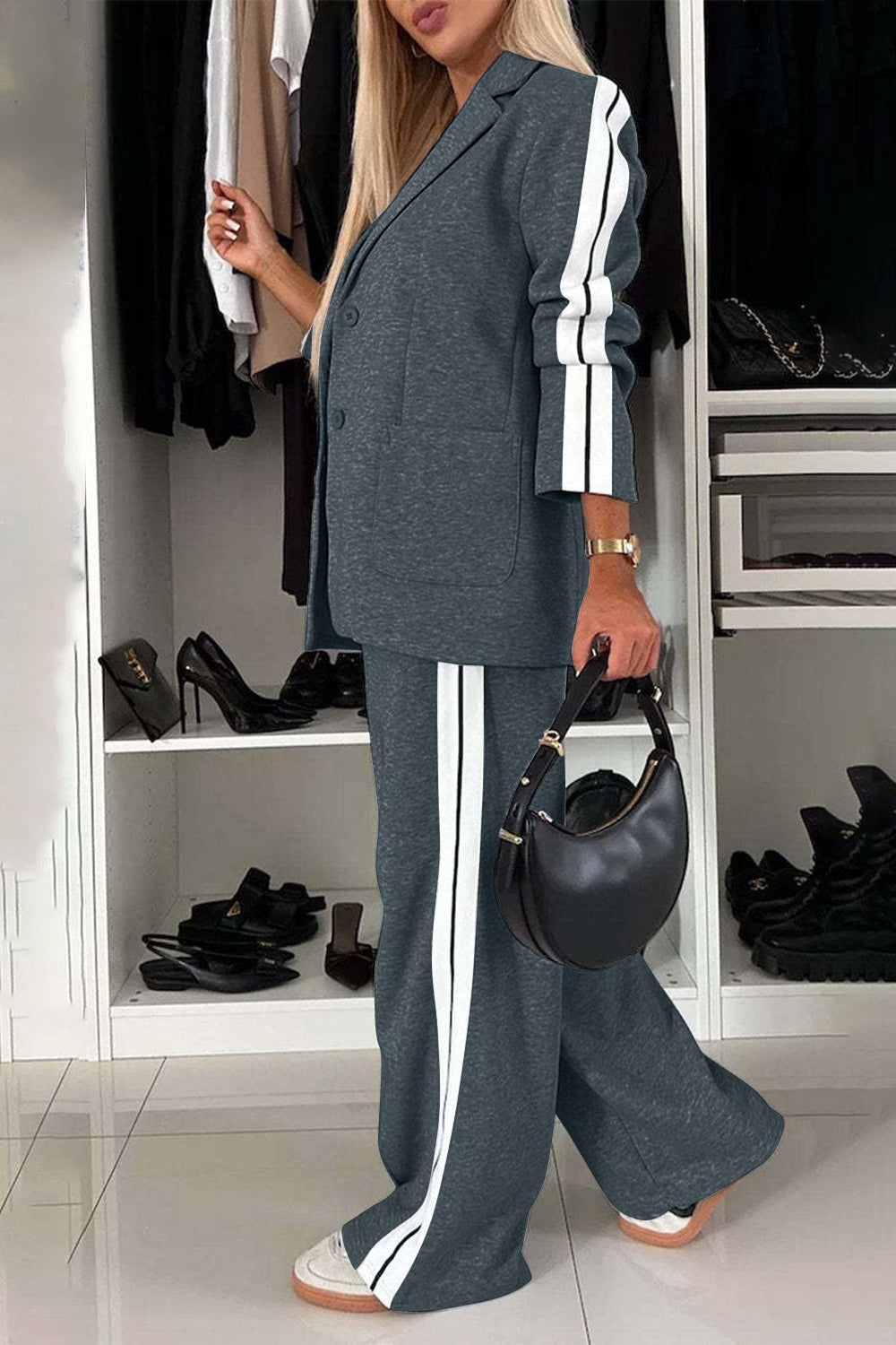Track stripe blazer and trouser set in dark gray with white side stripes.