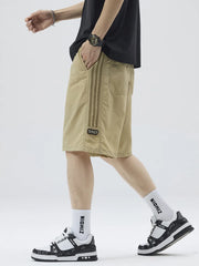 Khaki casual drawstring shorts with sporty side stripes and a number patch.