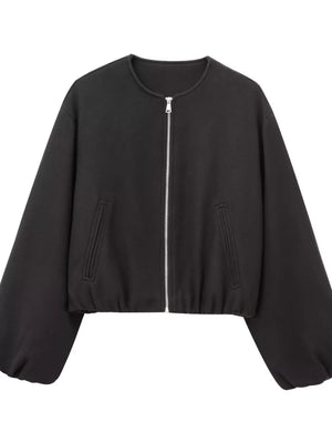 Black cropped bomber jacket with zip front and balloon sleeves.