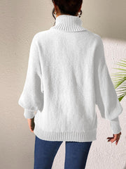 White knit turtleneck sweater with balloon sleeves and ribbed trim.