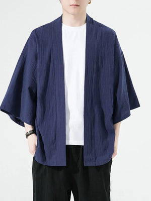Navy blue oversized casual open front jacket with textured fabric and wide sleeves.