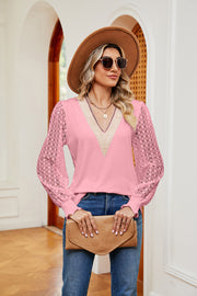 Pink knit v-neck blouse with lace sleeves and textured trim