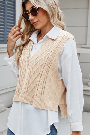 Tan cable knit diamond pattern sweater vest with V-neck and side slits.