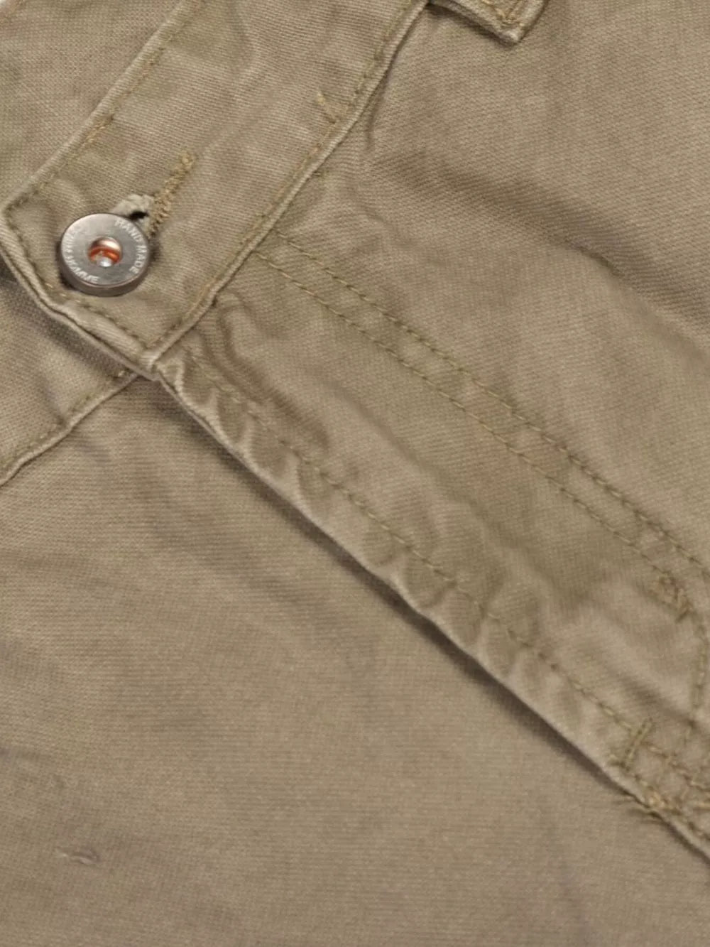 Khaki cargo pants with distressed details and button closure.