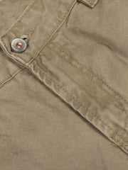 Khaki cargo pants with distressed details and button closure.