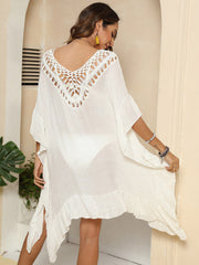 Ivory crochet yoke ruffle hem cover-up with V-neck and bell sleeves.