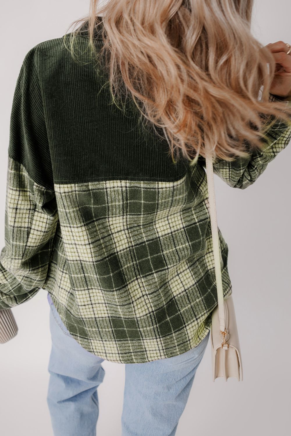 Corduroy yoke plaid overshirt in black forest with collared neckline.