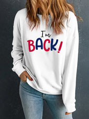 White crewneck sweatshirt with black and red "I'm BACK!" graphic print