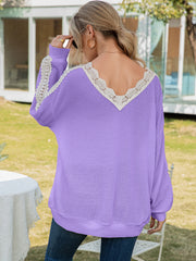 Lavender waffle knit top with lace trim V-neck and sleeves.