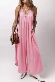 Pink pocketed wide leg jumpsuit with V-neck and pleats.