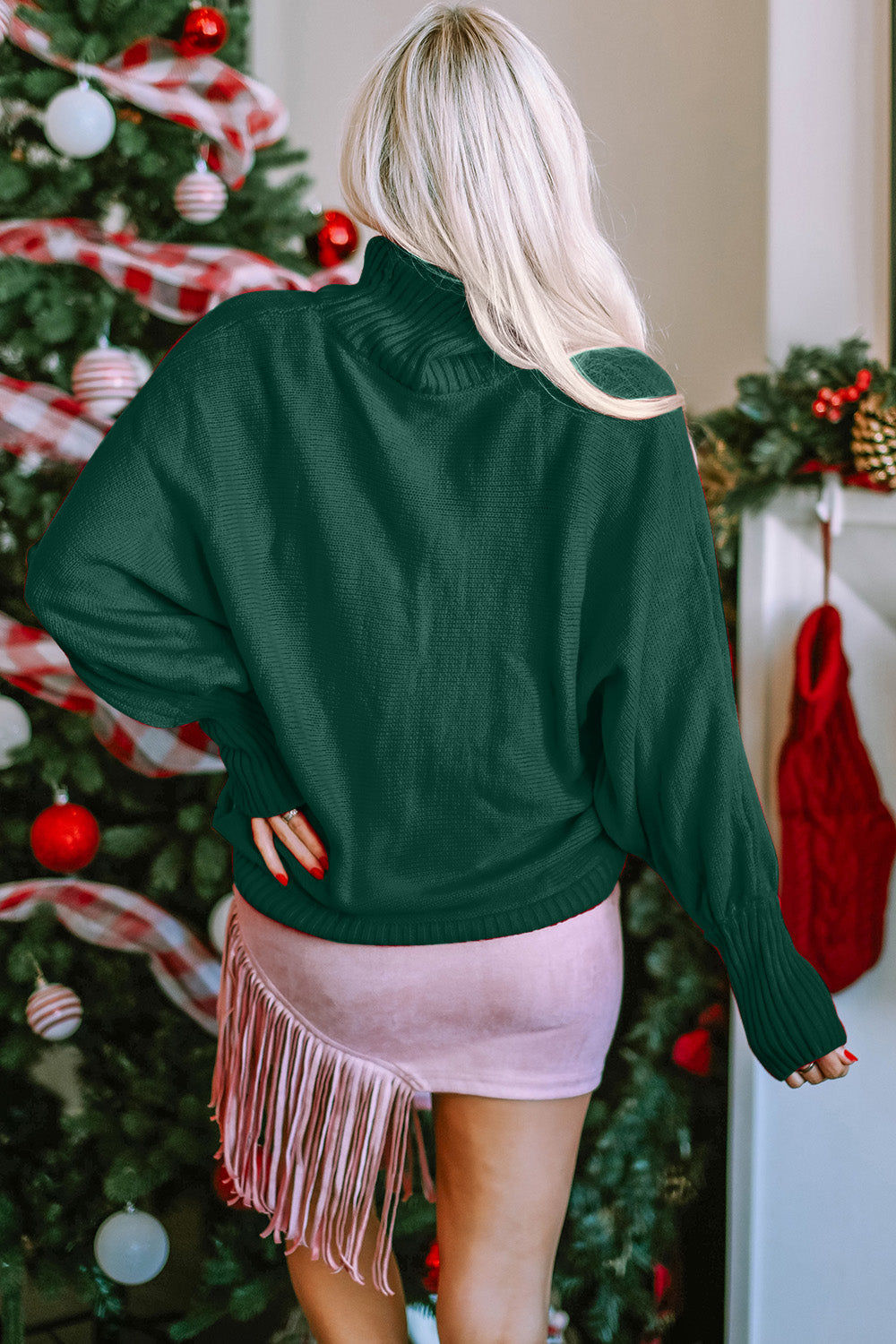 Dark green acrylic turtleneck sweater with dolman sleeves and ribbed cuffs.