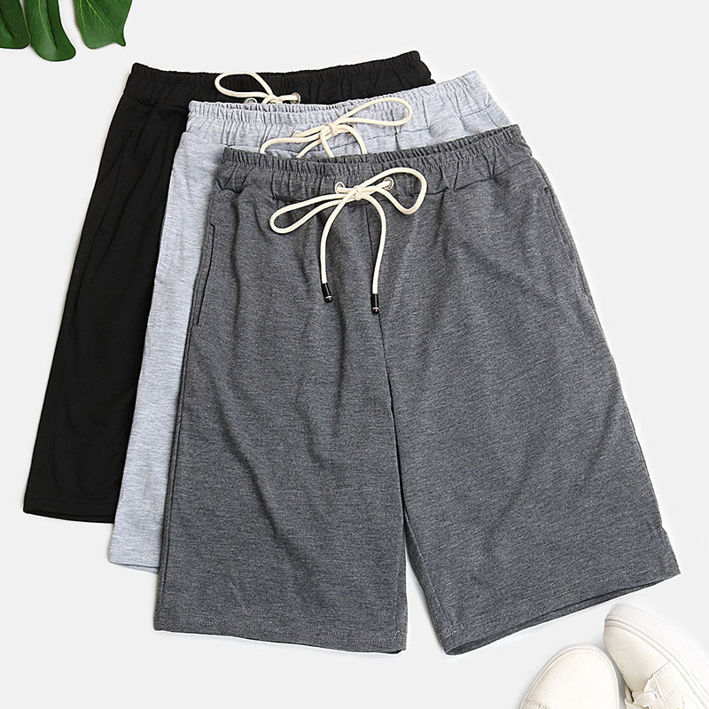 Relaxed culotte lounge shorts in black, light gray, and dark gray with drawstring waists.