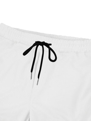 White waffle knit joggers with black drawstring detail