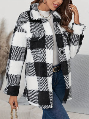 Oversized black and white checkerboard sherpa shacket with button front and chest pockets.