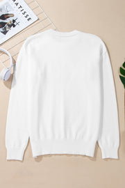 White drop shoulder knit sweater with ribbed cuffs and hem.