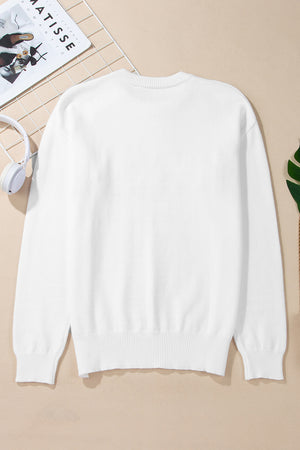 White drop shoulder knit sweater with ribbed cuffs and hem.