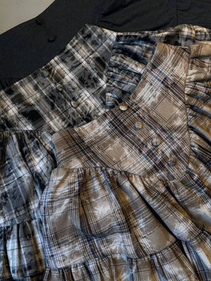Plaid puff sleeve set with ruffled hem in beige and dark gray, featuring button details.