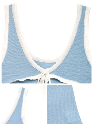 Chic tie-front viscose tank top in blue with white trim and a tie detail.