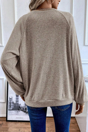 Mocha ribbed henley shirt with contrast collar detail, long sleeves, and crew neck.