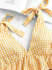 Yellow gingham mini dress with tie straps and V-neckline.