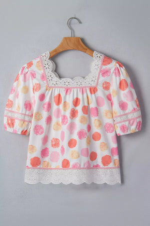 White polyester blouse with pink, orange, and yellow polka dots, puff sleeves, square neckline, and lace trim.