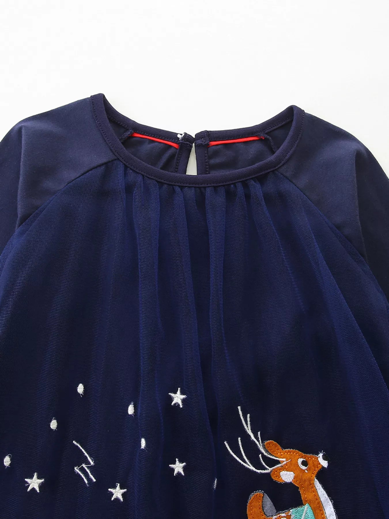 Navy tulle baby dress with embroidered deer and stars, round neckline, keyhole back.