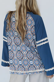 Dusty blue bohemian print blouse with bell sleeves and lace trim