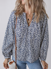 Navy floral print blouse with notched neckline and long sleeves