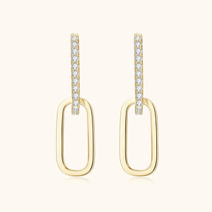 Gold geometric moissanite drop earrings with pave crystal detail.