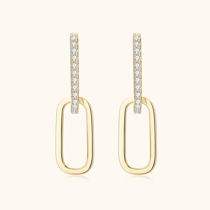 Gold geometric moissanite drop earrings with pave crystal detail.