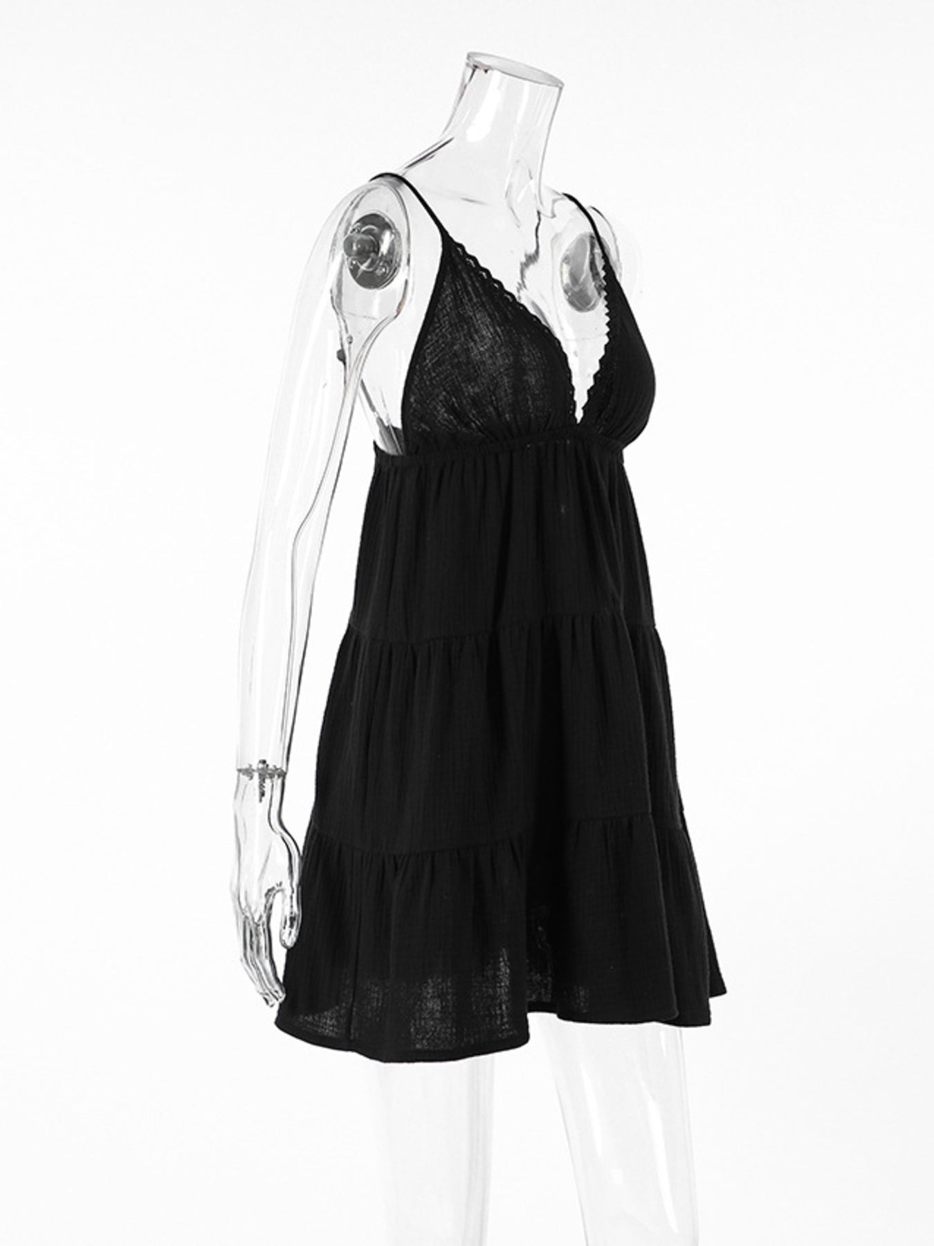 Black cotton tiered mini dress with lace trim and spaghetti straps