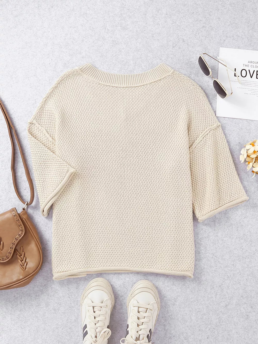 Beige V-neck knit sweater with subtle heart pattern, cotton blend, casual style.