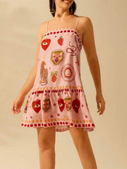 Pink ruffled mini dress with eclectic animal and heart print, square neck, spaghetti straps.