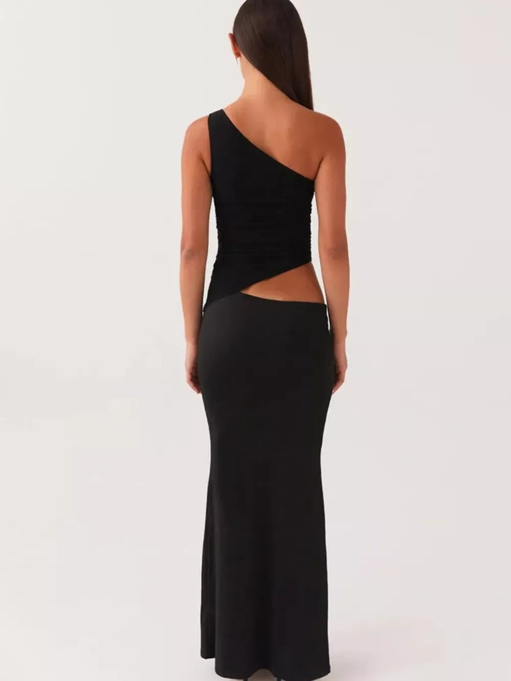 Black one-shoulder maxi dress with cutout detail and fitted skirt.
