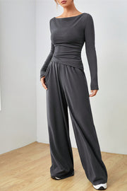 Boat neck lounge set in dark gray with wide leg pants and long sleeves.