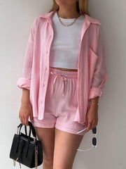 Textured gauze shirt and shorts set in hot pink, featuring a button-up shirt and drawstring shorts.