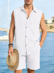 Men's white linen sleeveless shirt and shorts set with button front and chest pocket.