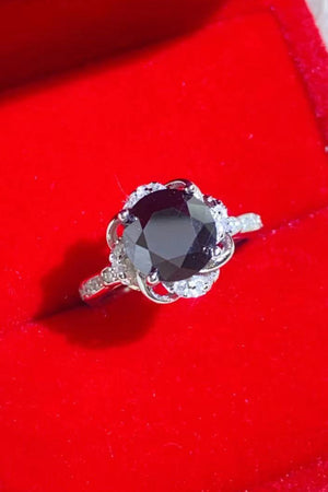 Black moissanite ring with diamond halo and floral setting