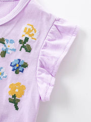 Lavender toddler dress with embroidered floral cross-stitch detail and ruffled sleeves.