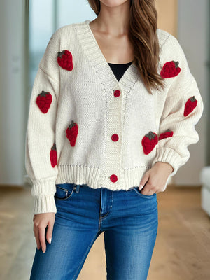Cream knit cardigan with red strawberry appliqués and red buttons