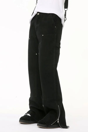 Black denim bootcut jeans with zip hem detail and utility pockets