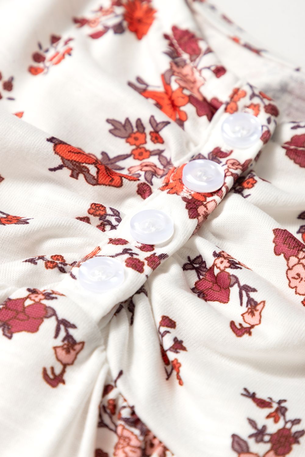 Gathered bust floral blouse with puff sleeves and button detail