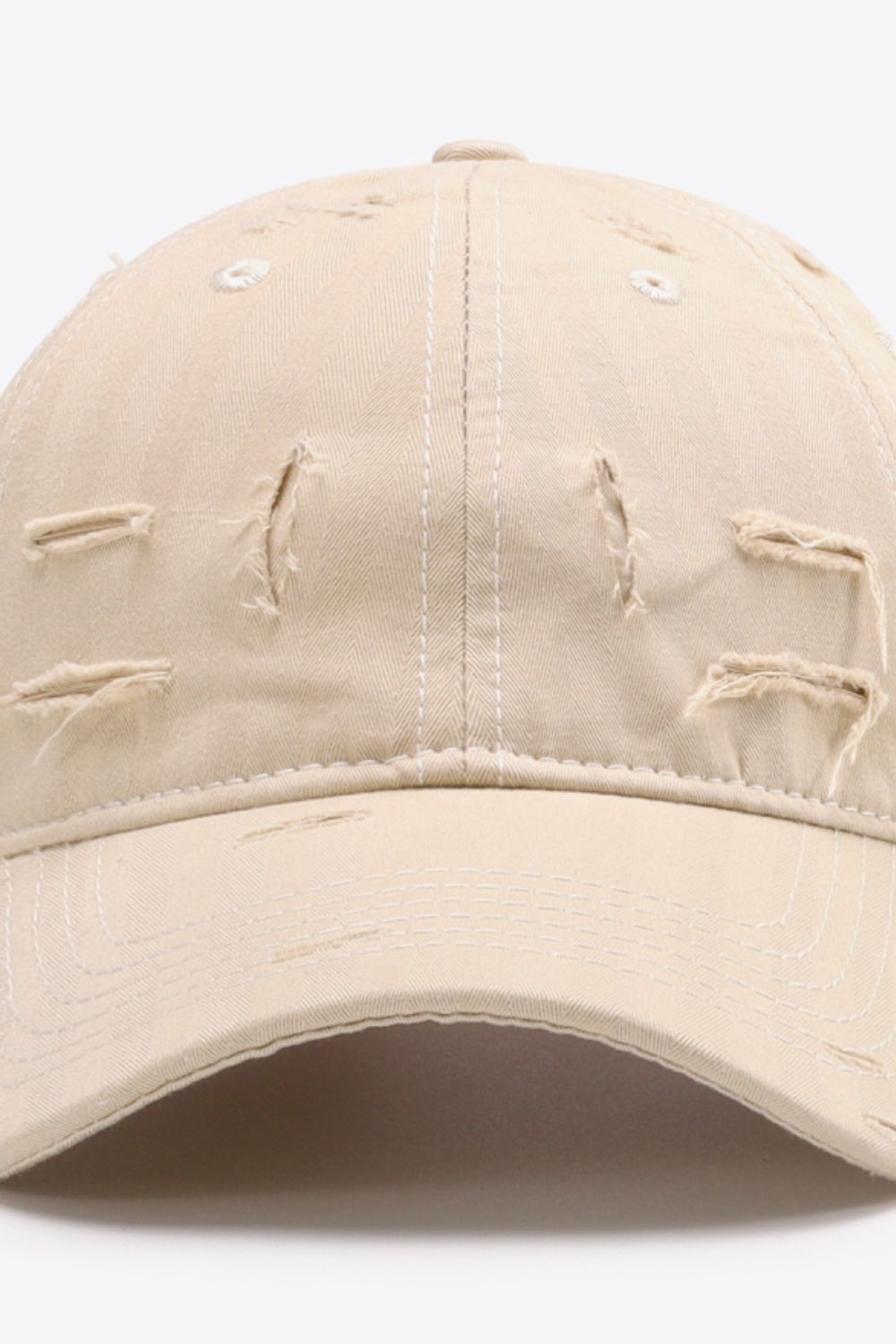 Sand baseball cap with distressed details and white stitching