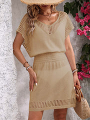 Beige knit mesh V-neck short sleeve dress with smocked waist and crochet hem detail.