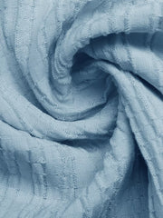 Blue smocked tiered maxi skirt fabric detail with subtle texture