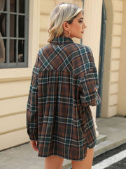 Brown plaid collared long sleeve shirt with button-down front and chest pockets.