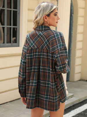 Brown plaid collared long sleeve shirt with button-down front and chest pockets.