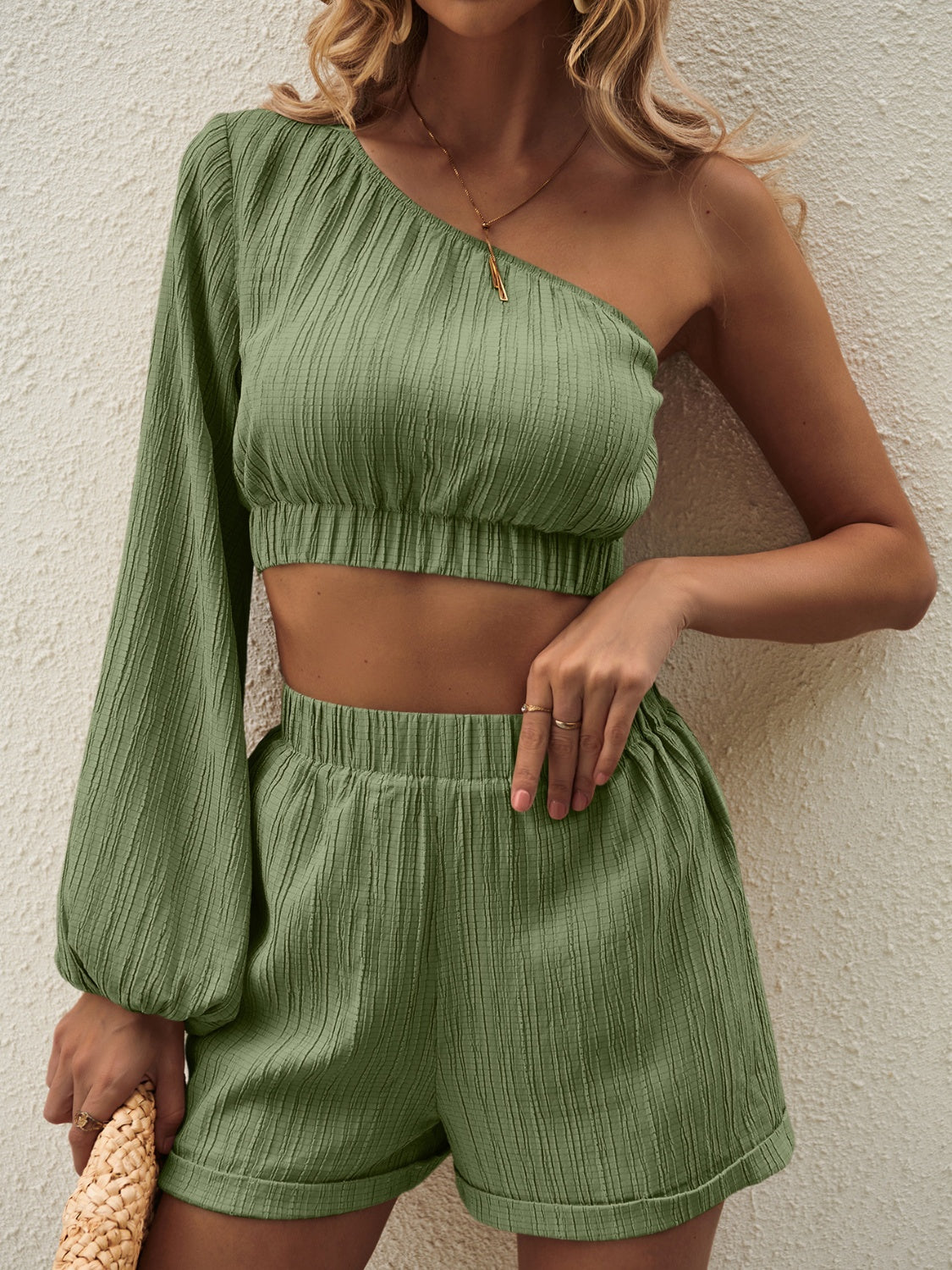 Textured one-shoulder crop top and shorts set in Matcha Green with balloon sleeve.