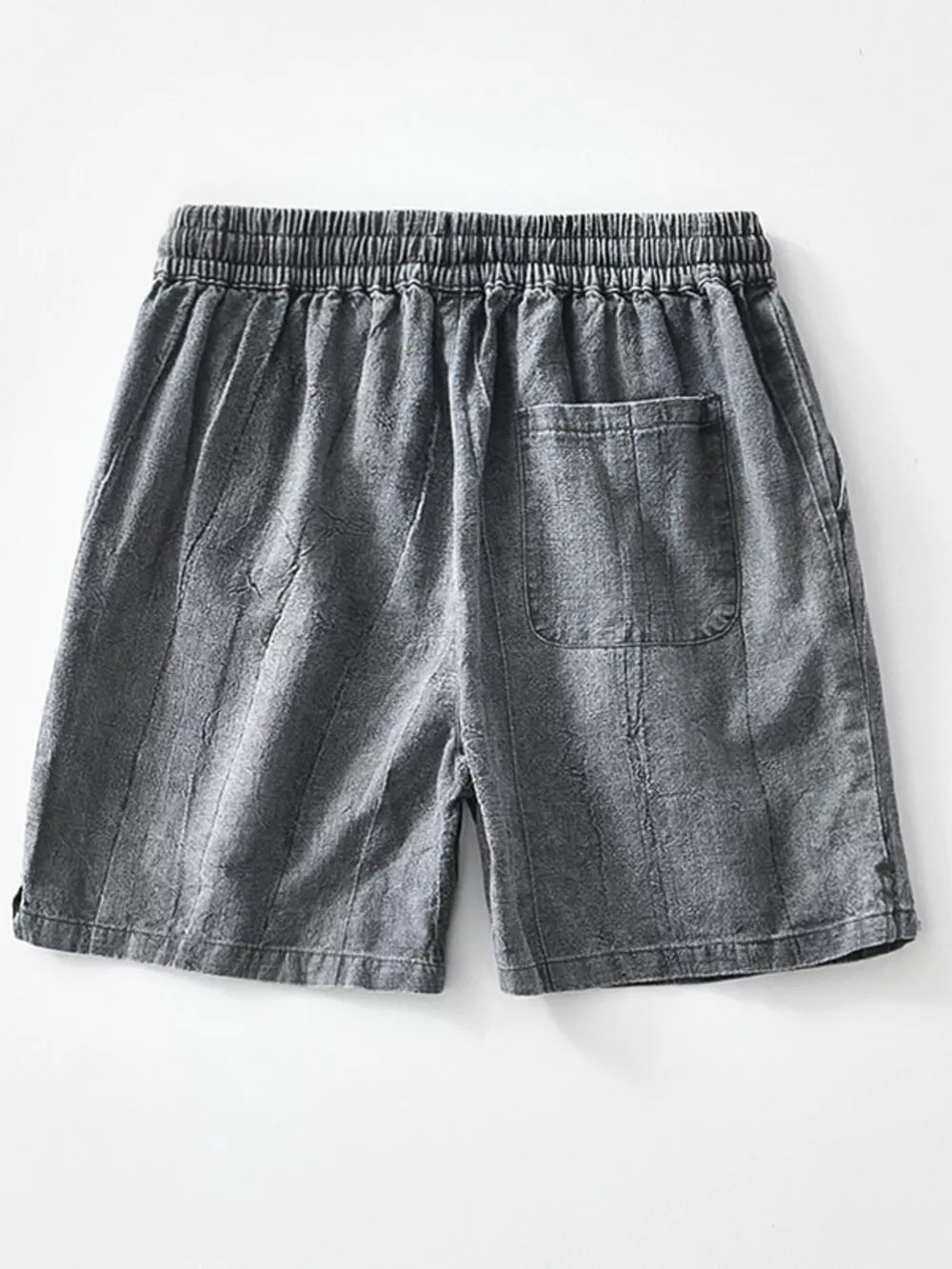 Relaxed fit men's gray drawstring shorts with a back pocket and vertical texture.